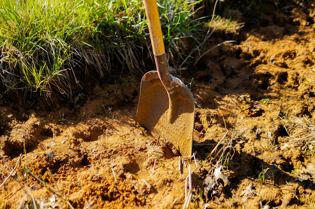 A shovel digging a hole in the dirt, a picture of the servant who buried his gold in the parable of the talents